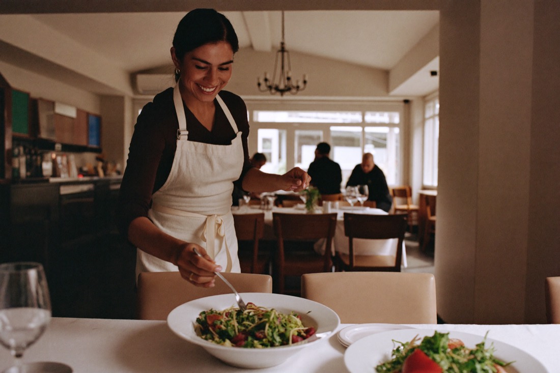 Server bringing food to a table
